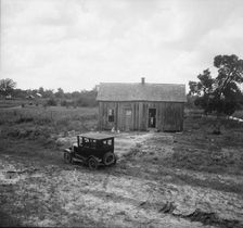 Home in a district from which many families immigrate West, near Sallisaw, Oklahoma, 1938. Creator: Dorothea Lange