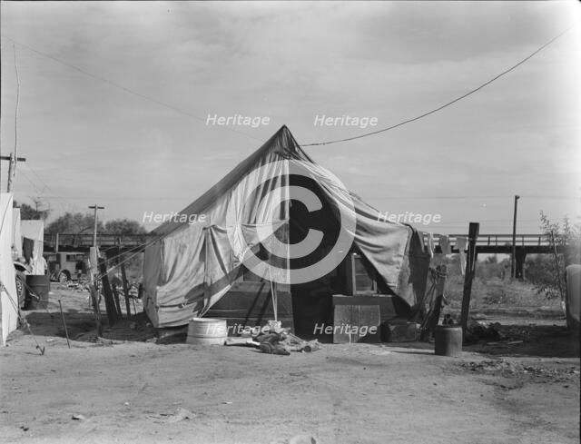 Home of a family of native Californians, migratory workers, Near Porterville, California, 1936. Creator: Dorothea Lange.