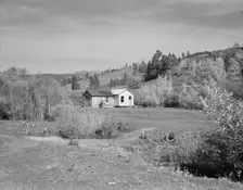 Home of Claude Kanady, president of the Ola self-help sawmill co-op, Gem County, Idaho, 1939. Creator: Dorothea Lange