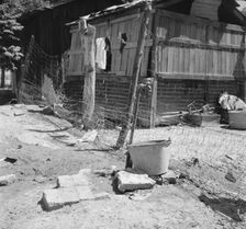 Home of Mexican field worker showing water supply, Brawley, Imperial Valley, California, 1935. Creator: Dorothea Lange