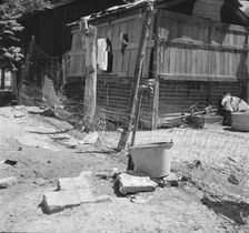 Home of Mexican field worker showing water supply, Brawley, Imperial Valley, California, 1935. Creator: Dorothea Lange