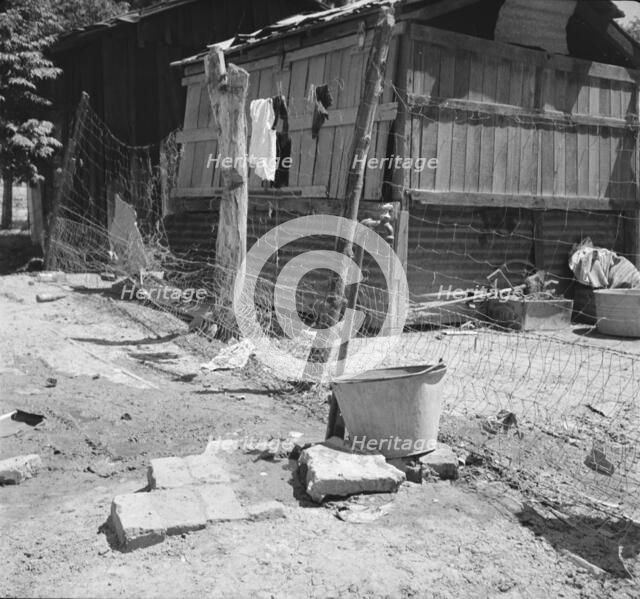 Home of Mexican field worker showing water supply, Brawley, Imperial Valley, California, 1935. Creator: Dorothea Lange.