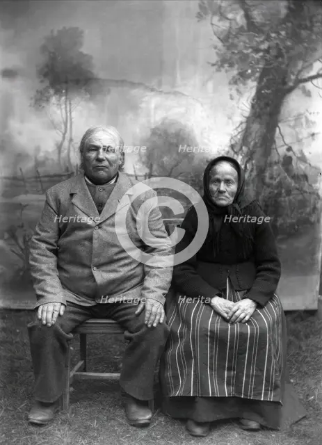 Homeowner and church steward Näs Jonas Jonsson (1825-1908) with his wife..., 1900-1908. Creator: Per Persson.