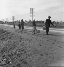 Homeless family of seven, walking the highway..., on U.S. 99, near Brawley, Imperial County, 1939. Creator: Dorothea Lange