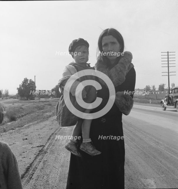 Homeless mother and youngest child of seven...on U.S. 99, near Brawley, Imperial County, 1939. Creator: Dorothea Lange.