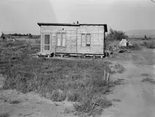 Homes are built bit by bit with whatever materials are available, Yakima,Washington, 1939. Creator: Dorothea Lange
