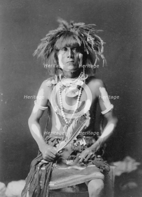 Honovi-Walpi snake priest, with Totkya Day painting, c1910. Creator: Edward Sheriff Curtis.