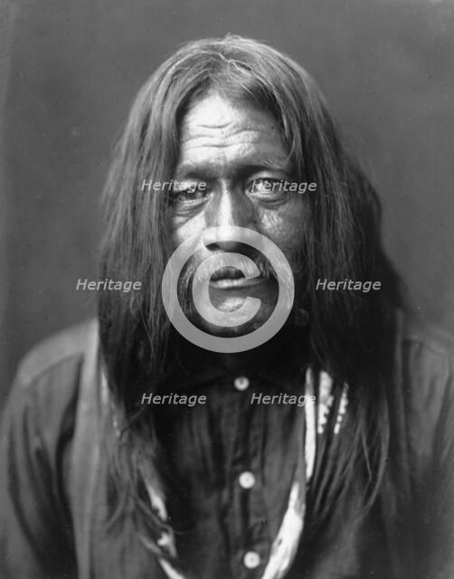 Hoo-Man-Hai, Maricopa Indian, head-and-shoulders portrait, facing front, c1907. Creator: Edward Sheriff Curtis.
