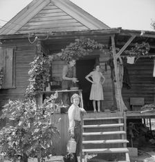 Hop farmer's children, small owner, and backyard..., near Independence, Polk County, Oregon, 1939. Creator: Dorothea Lange