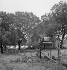 Hop grower's home on Rogue River, with the tent camp he..., near Medford, Jackson County, 1939. Creator: Dorothea Lange