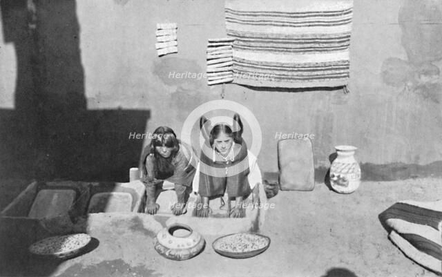 Hopi Indian women grinding corn meal, Walpi, Arizona, 1912. Artist: Robert Wilson Shufeldt.