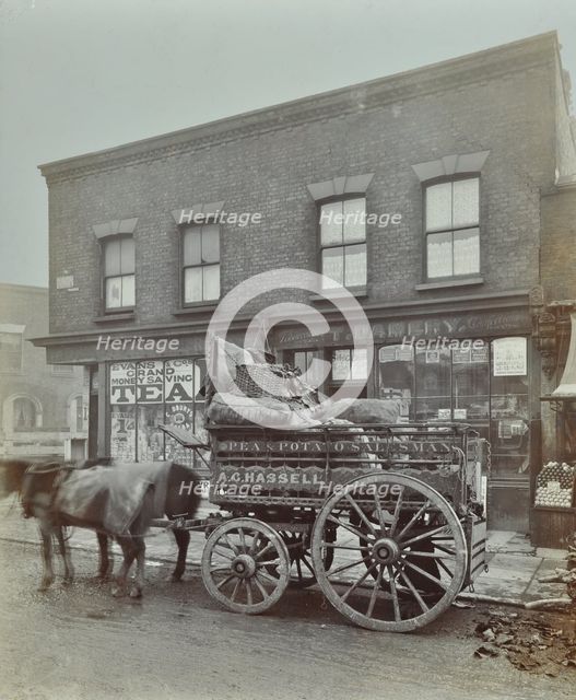 Horse and cart with sacks of vegetables, Bow, London, 1900. Artist: Unknown.