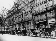 Horse-drawn cabs on a street during the German occupation, Paris, 1944