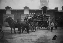 Horse-Drawn Departure of a Fire Ladder, early 20th century. Creator: Unknown