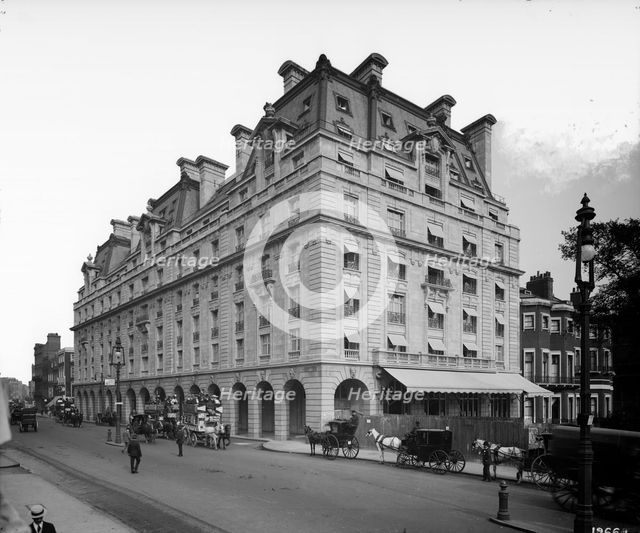 Horse drawn omnibuses and cabs pass the Ritz Hotel, Piccadilly, London, 1906. Artist: Bedford Lemere and Company