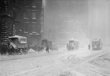Horse-drawn wagons on snowy street, NY snow storm, 1910. Creator: Bain News Service