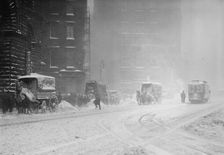Horse-drawn wagons on snowy street, NY snow storm, 1910. Creator: Bain News Service