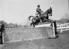 Horse Shows - Col. A.W. Dunn, Hurdling, 1911. Creator: Harris & Ewing