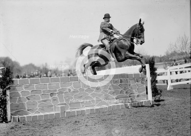 Horse Shows - Col. A.W. Dunn, Hurdling, 1911. Creator: Harris & Ewing.