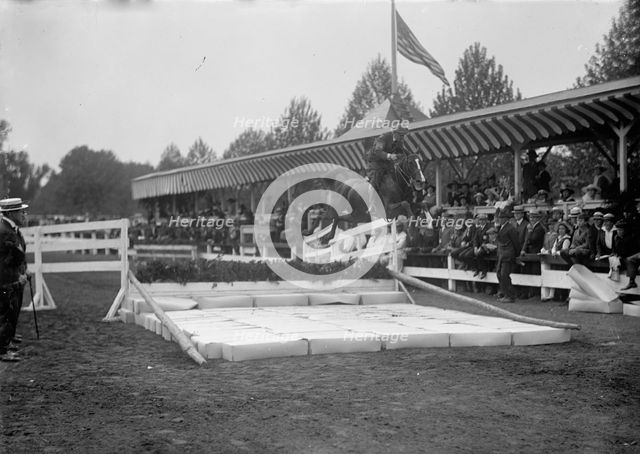 Horse Shows - Ralph Coffin; Broad Jump, 1917. Creator: Harris & Ewing.