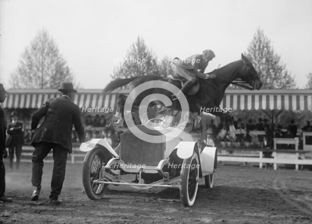 Horse Shows - Ralph Coffin Jumping His Horse Over Sylvanus Stoke's Rolls Royce, 1916. Creator: Harris & Ewing.