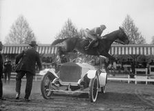Horse Shows - Ralph Coffin Jumping His Horse Over Sylvanus Stoke's Rolls Royce, 1916. Creator: Harris & Ewing