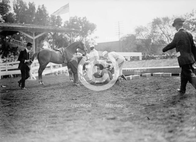 Horse Shows - Victor Mather Falling From 'Pagan Kin', 1912. Creator: Harris & Ewing.