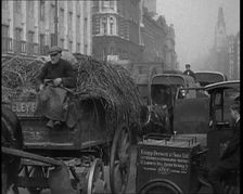 Horses and Carts Riding Through London, 1936. Creator: British Pathe Ltd