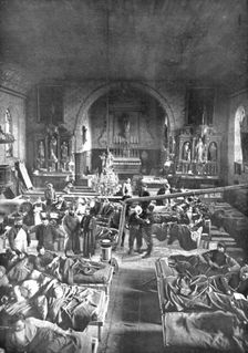 Hors de portee de l'artillerie allemande; Une ambulance de l'avant, dans une eglise 1915. Creator: Unknown