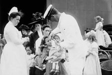 Hospital boat, a mother, her child, and a doctor, upper deck, 1910. Creator: Bain News Service