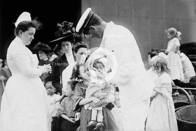 Hospital boat, a mother, her child, and a doctor, upper deck, 1910. Creator: Bain News Service.