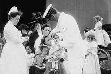 Hospital boat, a mother, her child, and a doctor, upper deck, 1910. Creator: Bain News Service