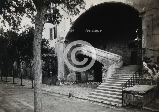 Hospital de la Santa Cruz, Barcelona: a staircase leading up to the men's department... Creator: Unknown.