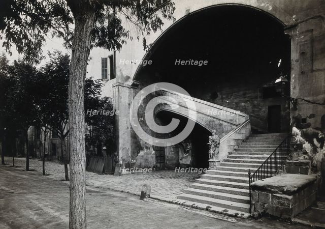 Hospital de la Santa Cruz, Barcelona: a staircase leading up to the men's department... Creator: Unknown.