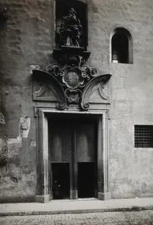 Hospital de la Santa Cruz, Barcelona: the doorway.. with a statue of Charity..., c1900s. Creator: Unknown