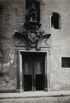 Hospital de la Santa Cruz, Barcelona: the doorway.. with a statue of Charity..., c1900s. Creator: Unknown