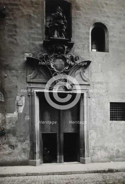 Hospital de la Santa Cruz, Barcelona: the doorway.. with a statue of Charity..., c1900s. Creator: Unknown.