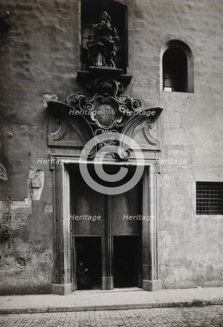 Hospital de la Santa Cruz, Barcelona: the doorway.. with a statue of Charity..., c1900s. Creator: Unknown.