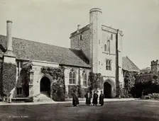 Hospital of Saint Cross, Winchester: four men standing in the courtyard, between 1800 and 1899. Creator: Unknown