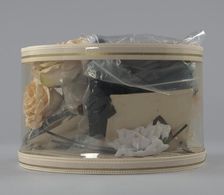 Hat box filled with tools and materials from Mae's Millinery Shop , 1941-1994. Creator: Unknown