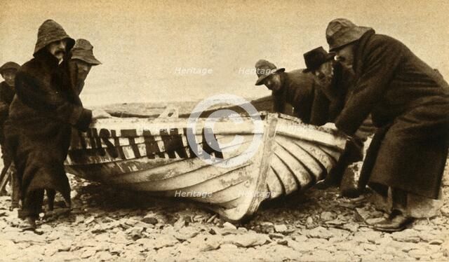 'Hauling up one of the Lusitania's boats', Ireland, May 1915, (1933).  Creator: Unknown.
