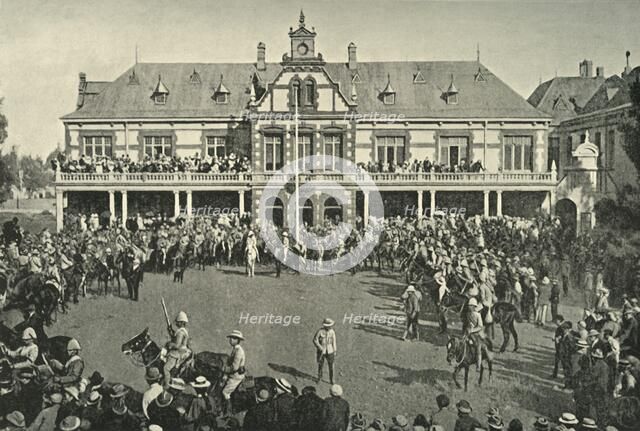 'Hauling Down the Transvaal Flag at Johannesburg', 1901. Creator: Lionel James.