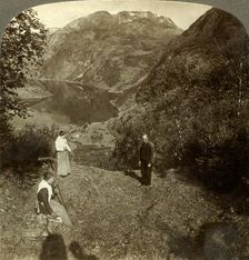 Haying on mountain shelf high above Marok village and mirror-clear Geirangerfjord, Norway c1905 Creator: Unknown
