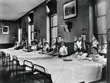 Hahnemann Hospital and Homeopathic Dispensaries, Liverpool: a women's ward, decorated..., [1910?]. Creator: Unknown
