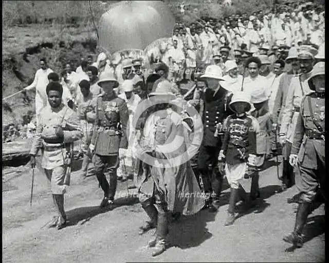 Haile Selassie I, Emperor of Ethiopia Walking with a Crowd, 1930s. Creator: British Pathe Ltd.
