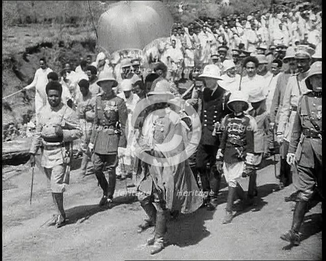 Haile Selassie I, Emperor of Ethiopia Walking with a Crowd, 1930s. Creator: British Pathe Ltd.
