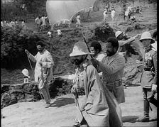 Haile Selassie I, Emperor of Ethiopia Walking with a Crowd, 1930s. Creator: British Pathe Ltd