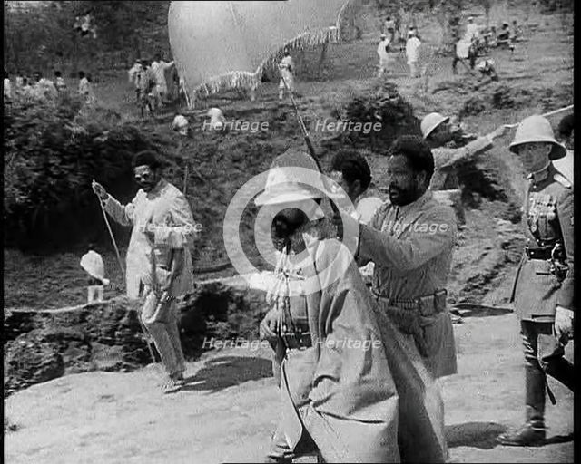 Haile Selassie I, Emperor of Ethiopia Walking with a Crowd, 1930s. Creator: British Pathe Ltd.