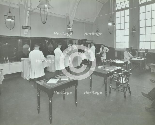 Hair dressing class for men at the Bromley Non-Residential Training Centre, London, 1934. Artist: Unknown.