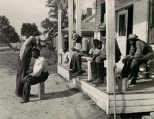 Haircutting in Front of General Store and Post Office on Marcella Plantation, Mileston, M..., 1939. Creator: Marion Post Wolcott